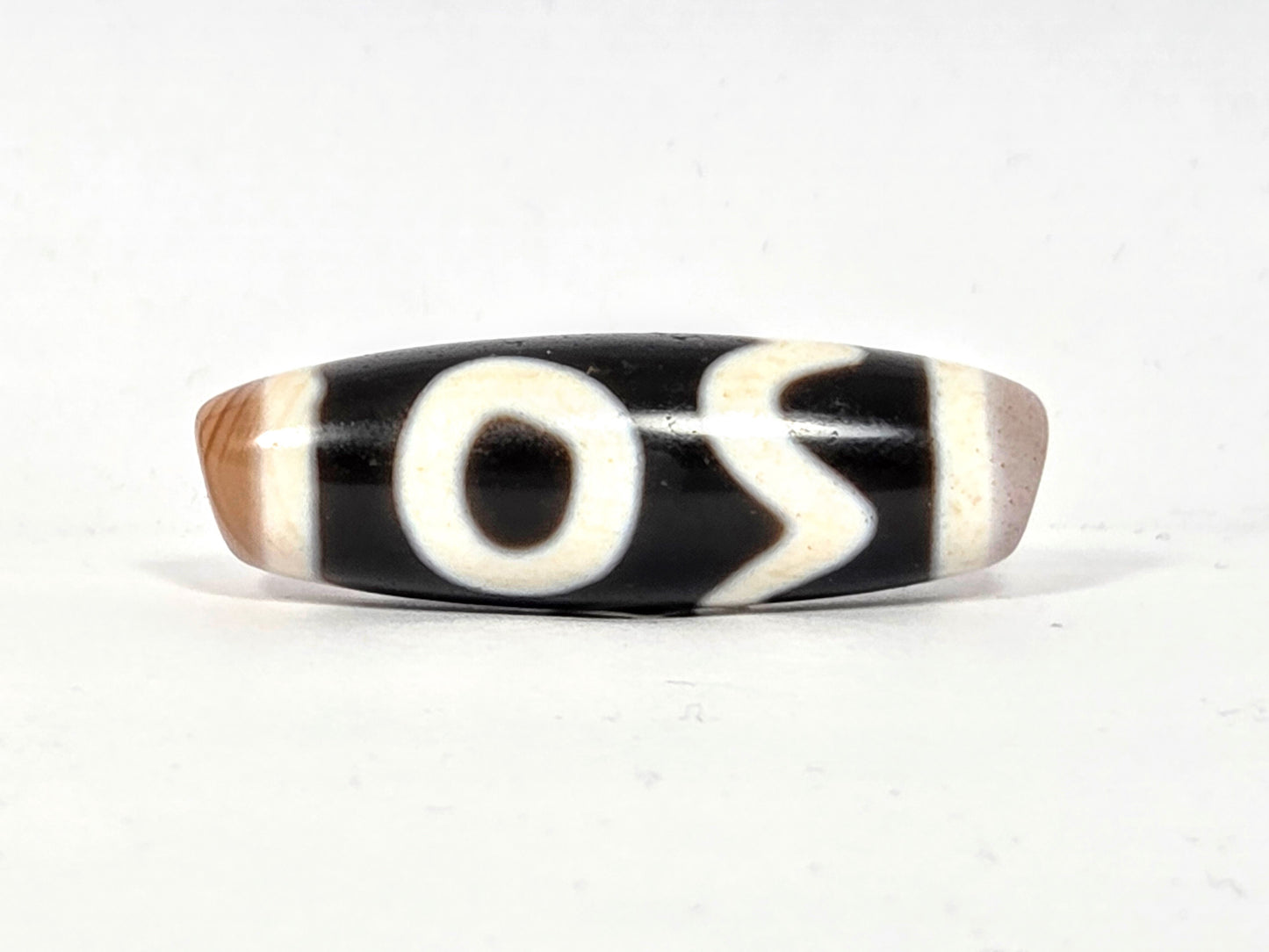 Antique Tibetan Dzi adorned with the Four Activities Motif - Beautiful Bloodspots