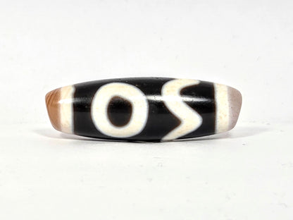 Antique Tibetan Dzi adorned with the Four Activities Motif - Beautiful Bloodspots