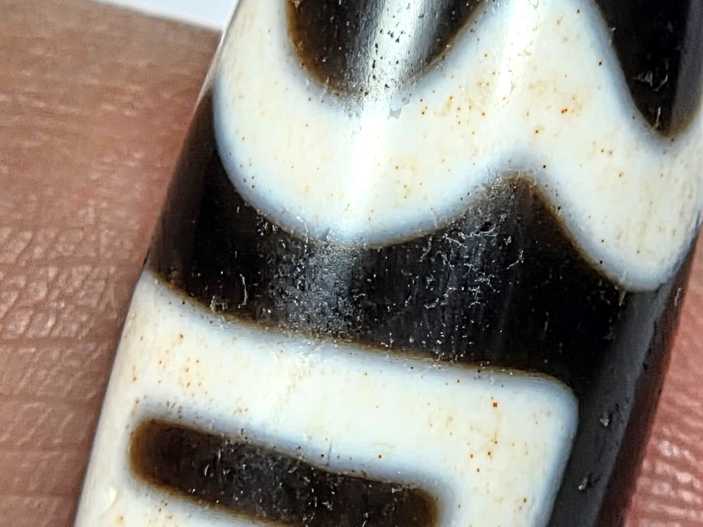 Antique Tibetan Dzi adorned with the Four Activities Motif - Beautiful Bloodspots