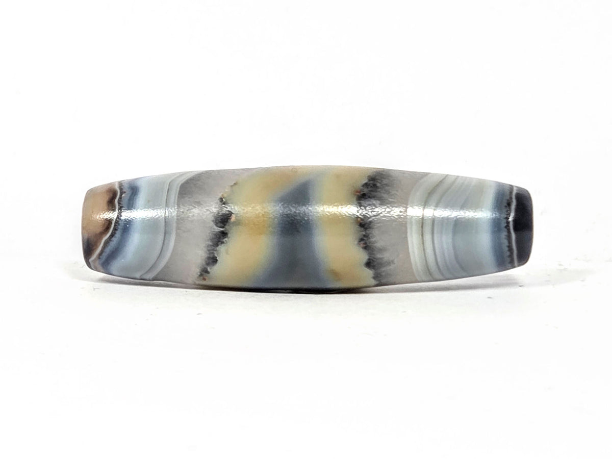Antique one-eye dzi bead, banded grey cream agate, elongated barrel shape, natural patina, polished surface