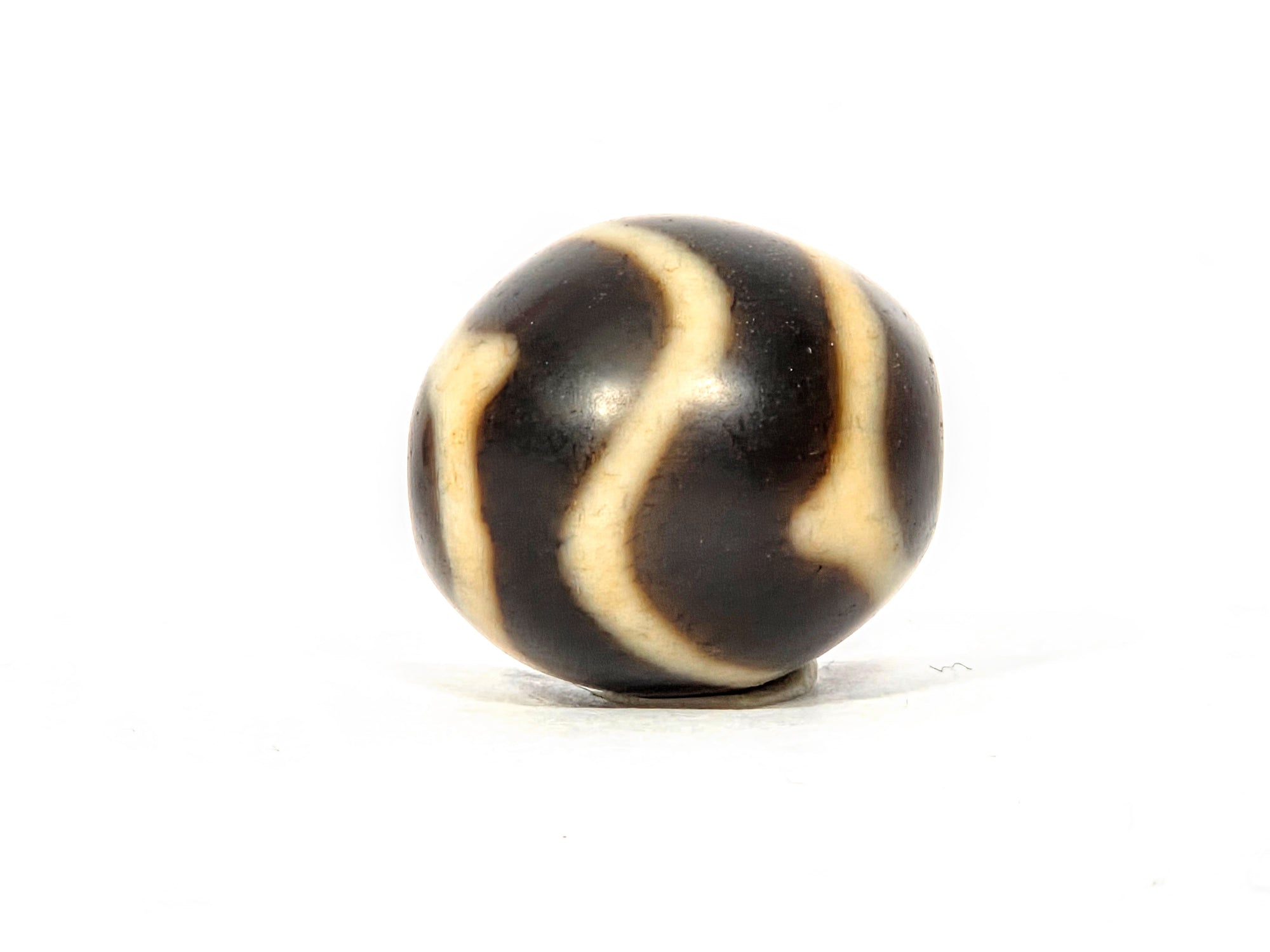 Antique Tibetan Round Dzi Bead featuring Wave & Tiger Tooth Motif (111325)