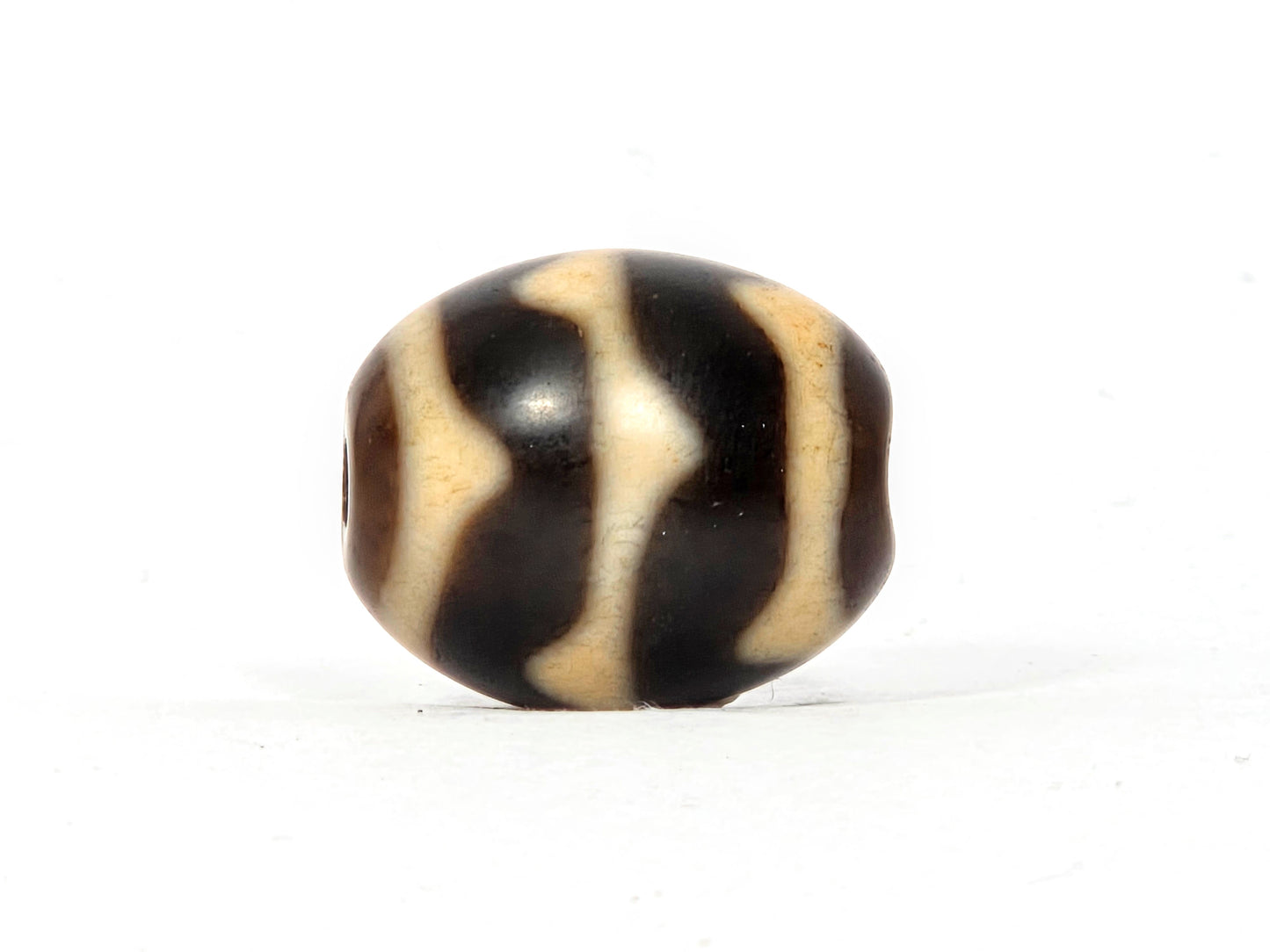 Antique Tibetan Round Dzi Bead featuring Double Wave Motif (110325)