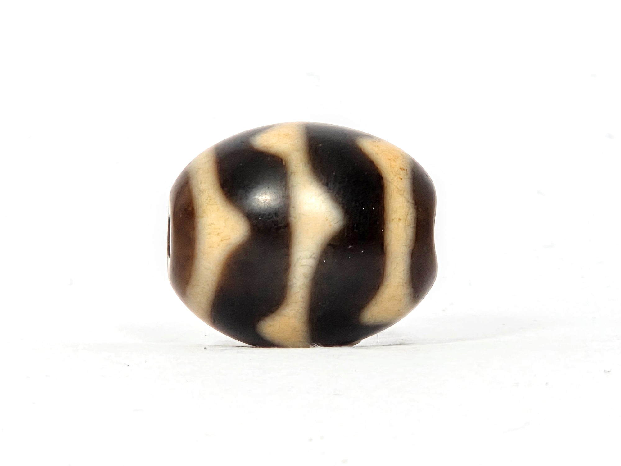 Antique Tibetan Round Dzi Bead featuring Double Wave Motif (110325)