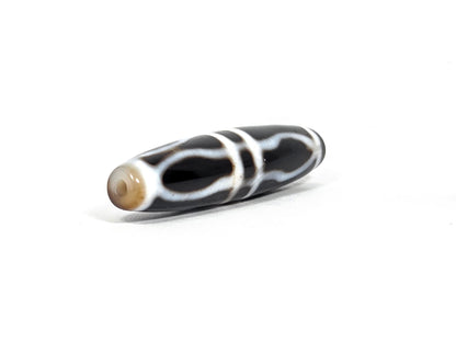 At-090226-3VJBS antique triple vajra dzi drill end view two warm medium brown tip agate unretouched