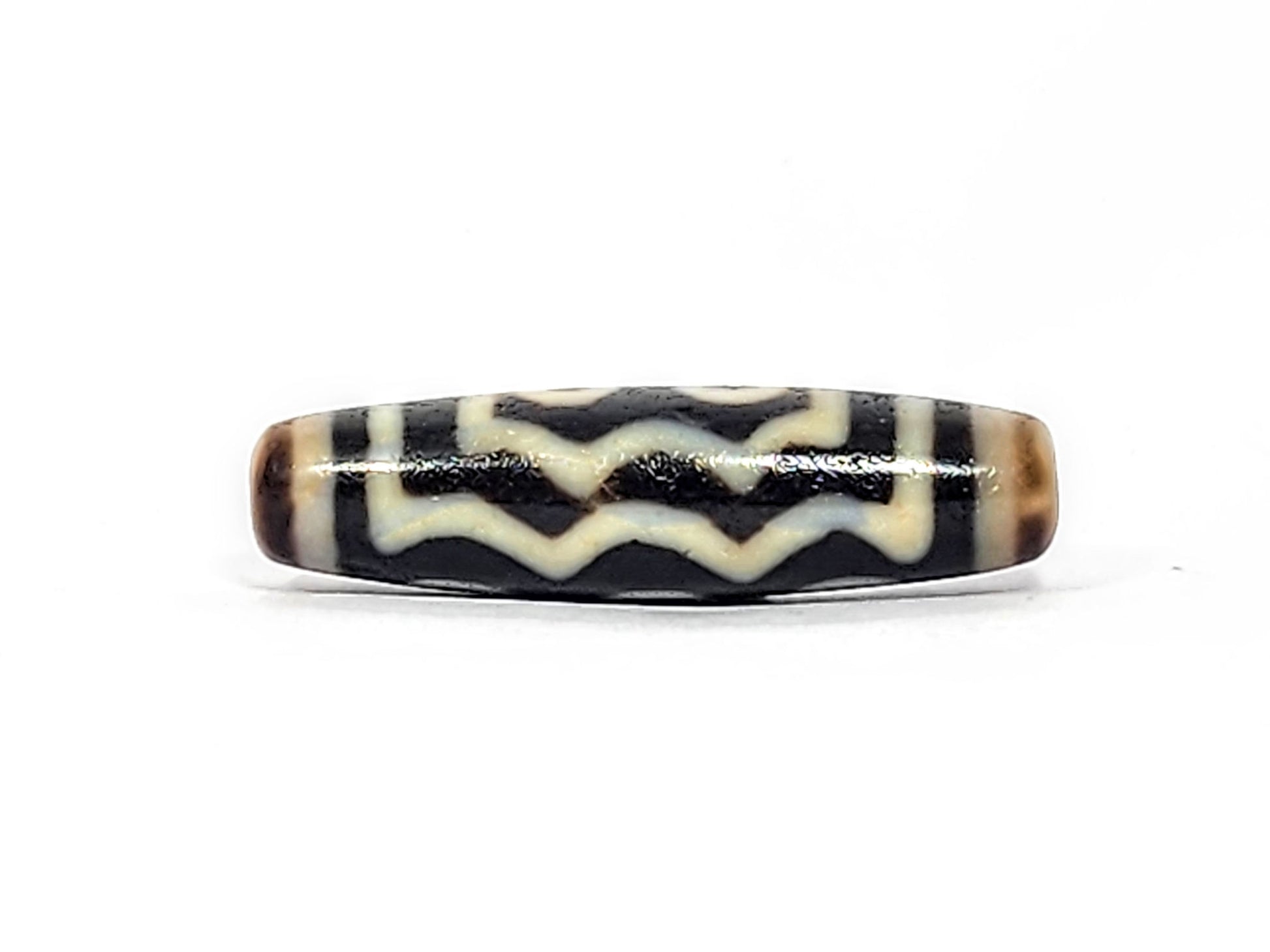 Face B of antique five eye dzi At-072625-5E, three rows of cream zigzag and wave lines on pitch-black agate, full-length wave composition, no eyes, unretouched