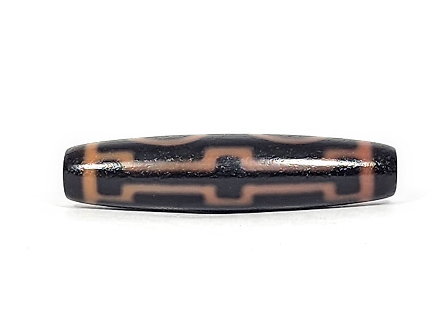 Third angle of antique Four Eye dzi At-012325-4E, amber eye rings and connecting stripes on dark brown agate, full torpedo body profile, 51.9mm × 12.2mm, unretouched photography