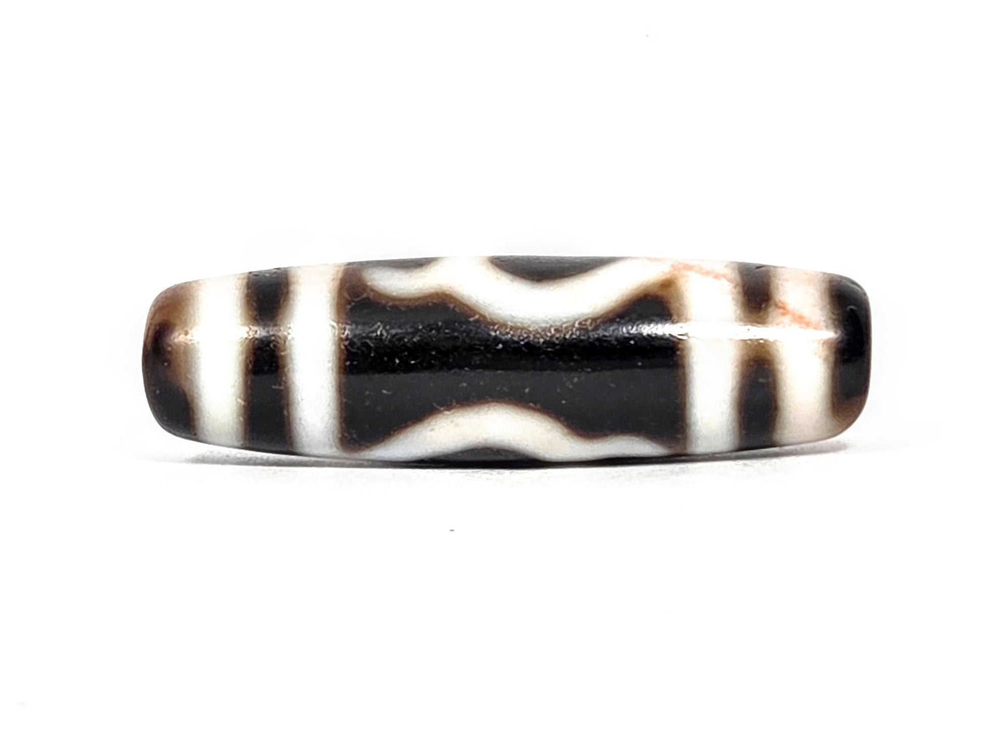 At-080426-GTBS antique Green Tara dzi bead 37.9×11.0mm, Face B showing double wave lines on pitch-black ground, stripe borders, unretouched