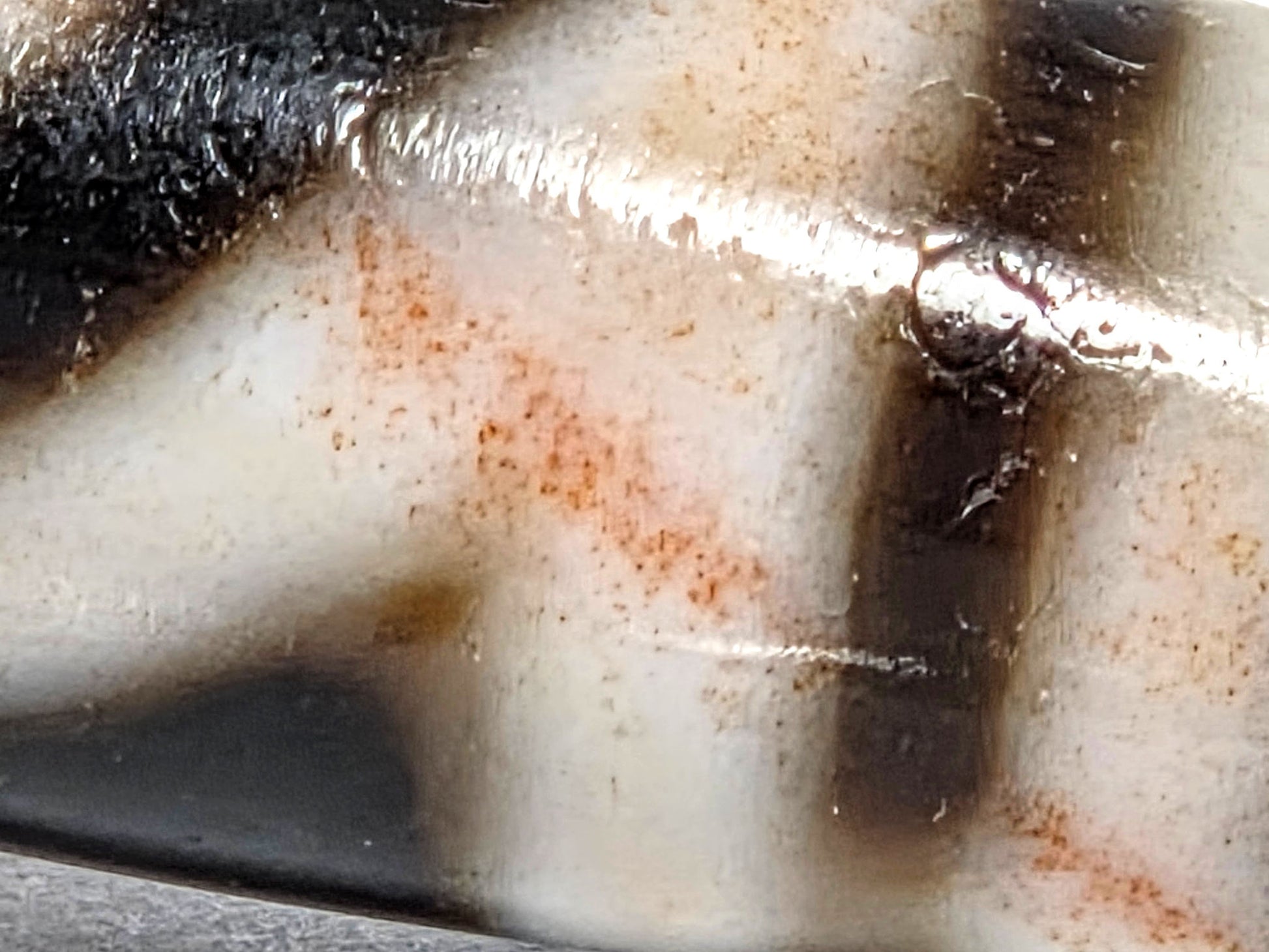 At-080426-GTBS macro view second cream panel showing continuous reddish-orange cinnabar field with micro-inclusions throughout, unretouched