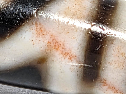 At-080426-GTBS macro view second cream panel showing continuous reddish-orange cinnabar field with micro-inclusions throughout, unretouched