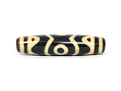 At-061926-3ETT connector face, tiger tooth X-chevron composition, no eye, pitch-black agate, unretouched