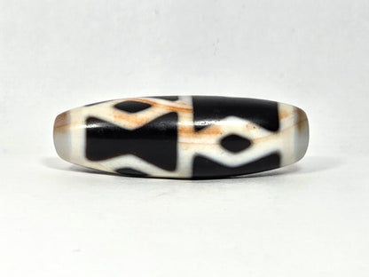 At-062126-6DE dzi bead, three-quarter angle, step-line divider detail, unretouched