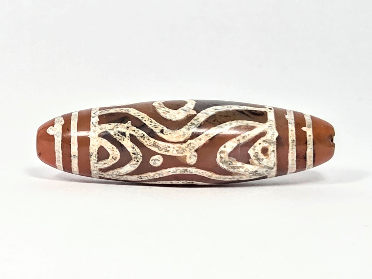 At-061426-2ETTSt carnelian dzi, Face B, tiger tooth arch + star dot elements, dark banding, unretouched