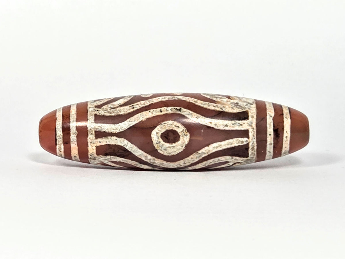 At-061426-2ETTSt carnelian dzi, Face C, second circular eye, open eye form, warm terracotta ground, unretouched