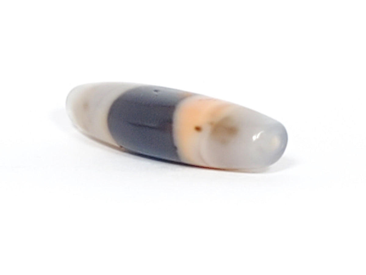 At-061526-1SBow, drill hole end cap face, milky grey-white agate, matte-satin finish, pinholes visible, unretouched