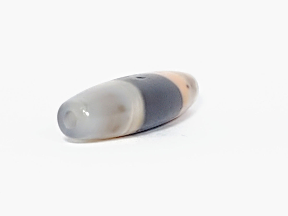 At-061526-1SBow, 3/4 view showing dome tip and drill hole end, cool milky grey-white end cap, unretouched
