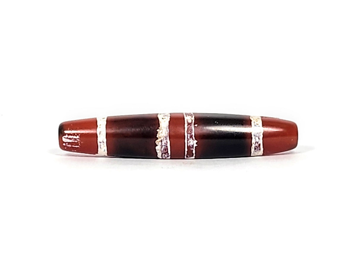 At-122324-3TS antique 3-stripe carnelian dzi, right end cap, cream-white stripe texture, pitch-black body, unretouched