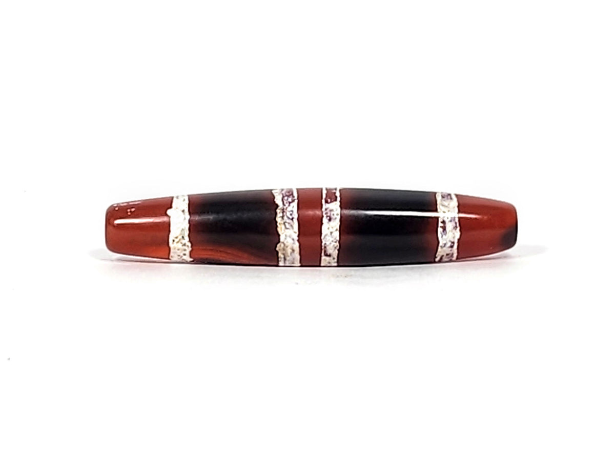 At-122324-3TS antique 3-stripe carnelian dzi, third face, mineral deposits at drill rim, etched stripe detail, unretouched