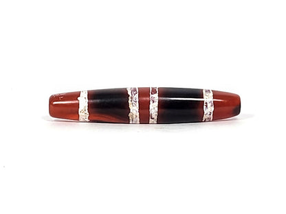 At-122324-3TS antique 3-stripe carnelian dzi, third face, mineral deposits at drill rim, etched stripe detail, unretouched