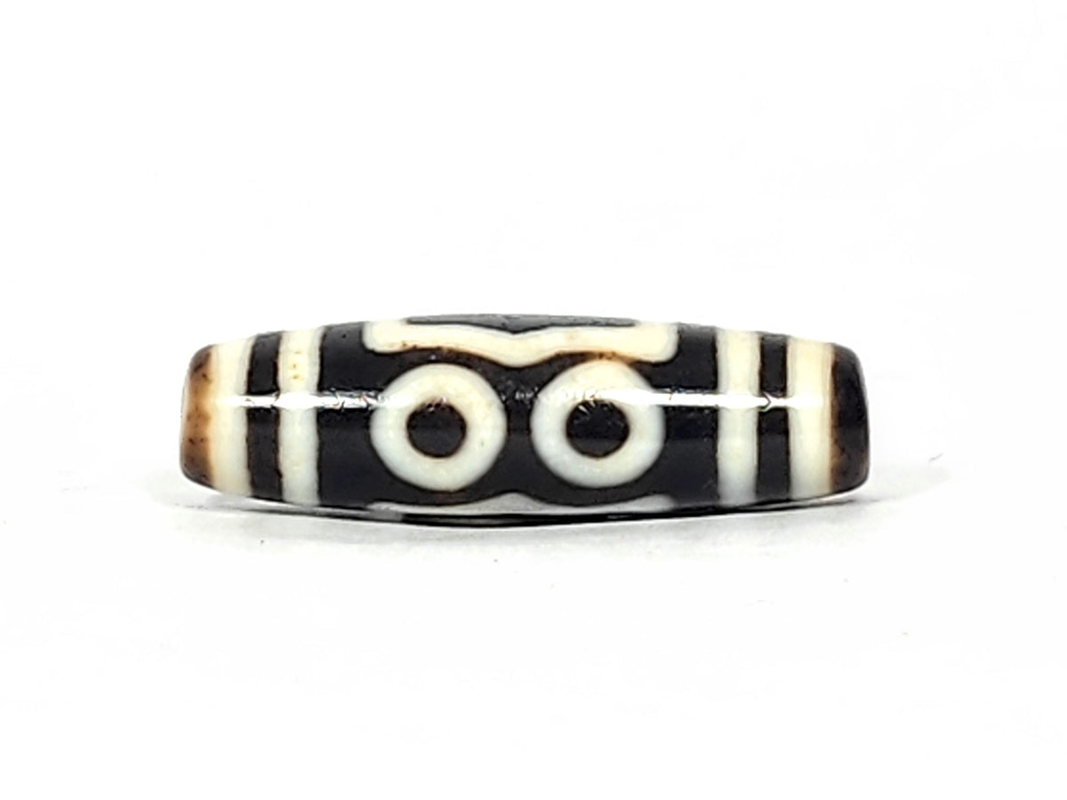 At-061926-4EEG Face B earth gate, concentric shield frame, pitch-black ground, cream-white lines, unretouched