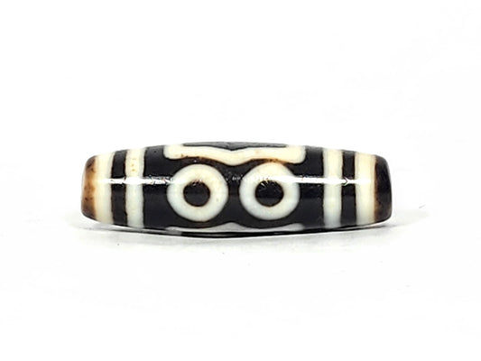 At-061926-4EEG Face B earth gate, concentric shield frame, pitch-black ground, cream-white lines, unretouched