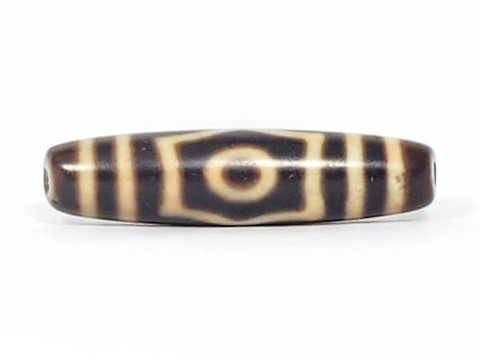 Antique Tibetan 3-eye dzi bead, dark brown agate, cream eye motifs, striped pattern, aged patina, visible drill holes
