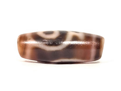 At-061826-2ETV lower connector face, warm reddish-brown translucent chalcedony, motif wrap-around visible, unretouched