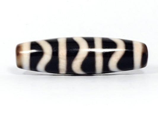 Opposite end view of antique Wave Stripe dzi bead showing drill hole and warm brown agate cap, At-052526-WS