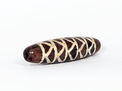 At-040524-TTStr antique carnelian dzi, right end cap, warm reddish-brown cap, drill hole, motif wrap detail, unretouched
