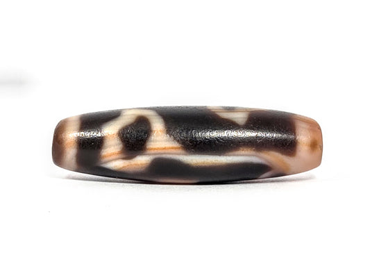Lotus Bud bloodspot At-072226-LBBS 43.1×12.5mm very dark brown agate face A — bud arch, cream motif, unretouched.