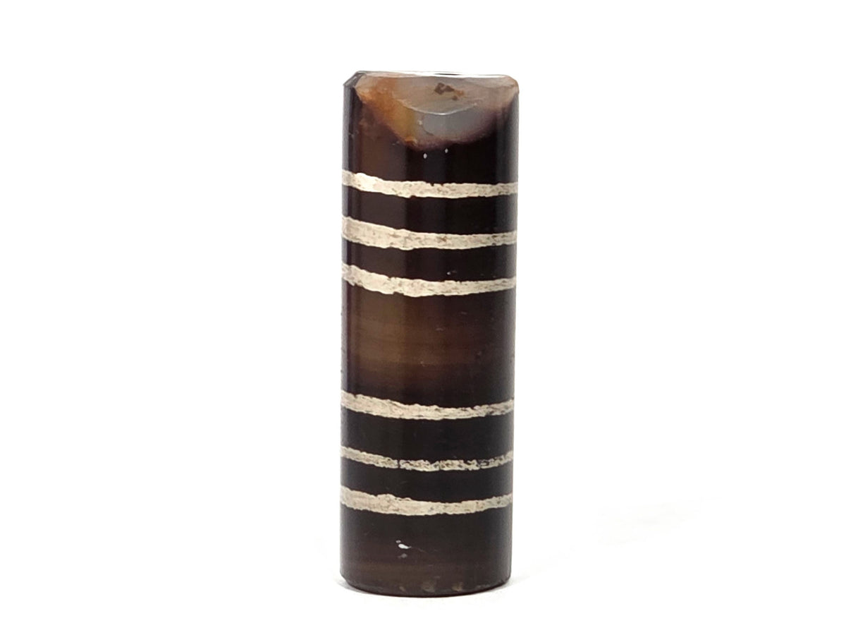 Ac-062226-6Str, reverse face view, six stripe agate dzi, warm dark brown, chip at top rim visible, unretouched