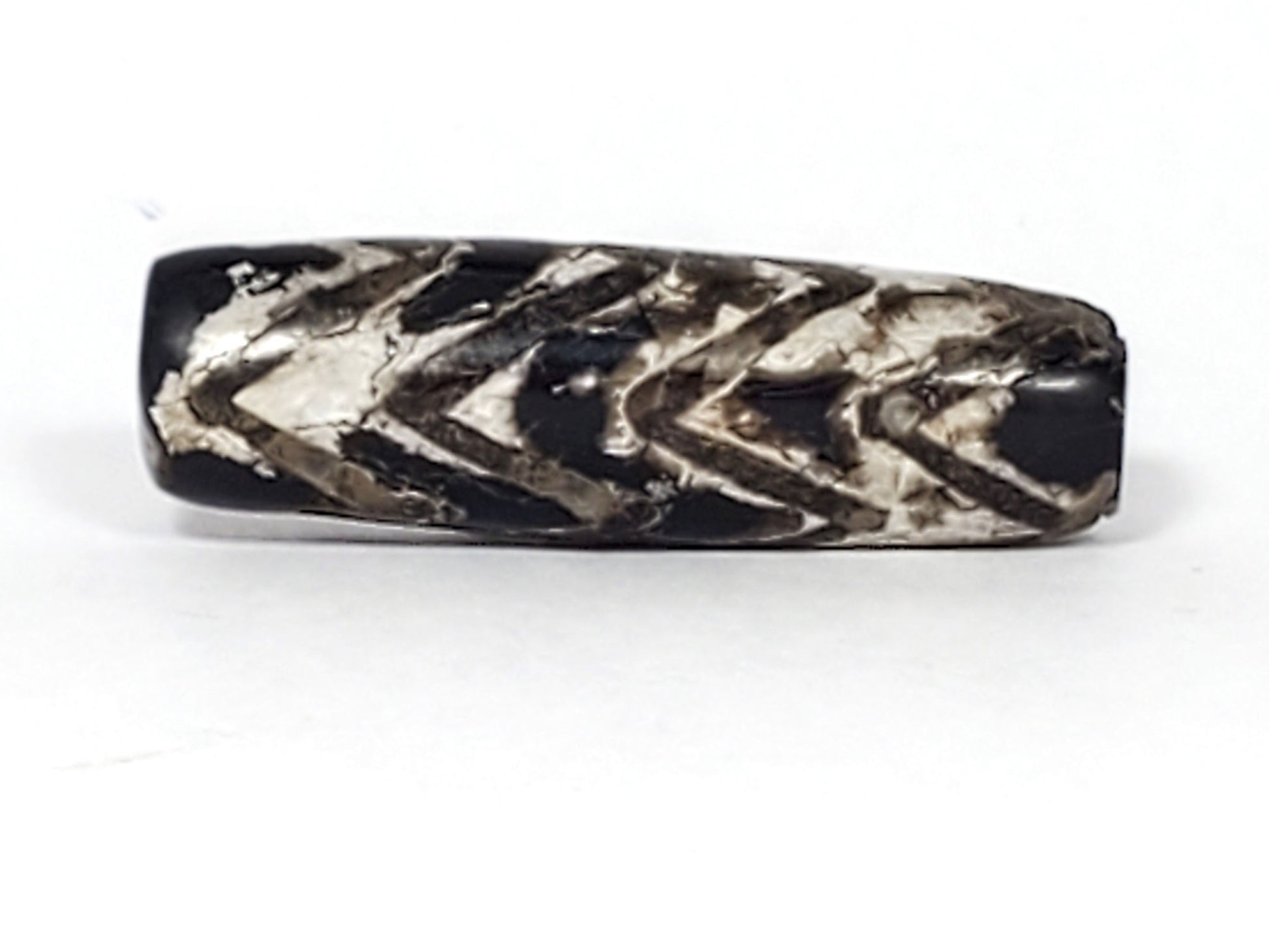 Second face of ancient Four-Row Tiger Tooth Dzi bead — heavy cream-grey calcification over bold chevron etching, 800–1,000 year old genuine Tibetan amulet