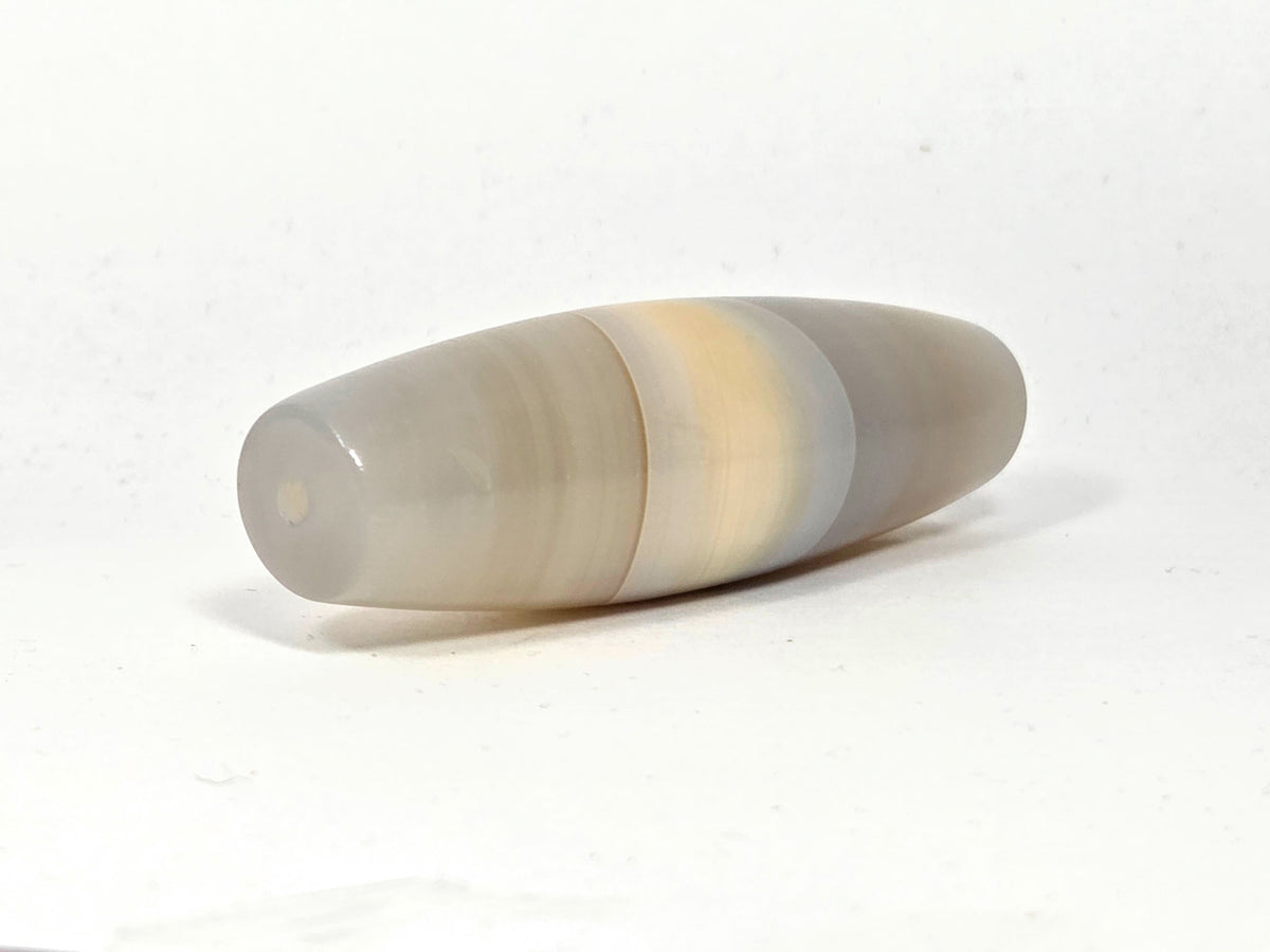 N-N-062126-1E angled end view, natural banding wraps tip