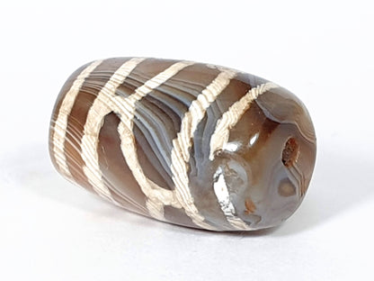 Antique longevity dzi — opposite end angled, drill hole at rounded tip, orange inclusion, agate banding rings, At-0426-Lon2