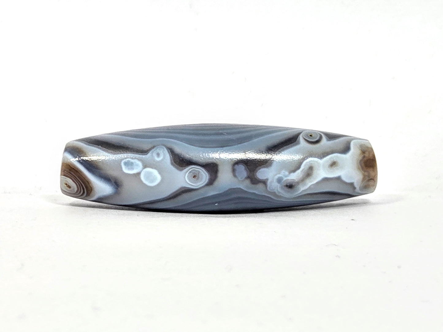 Antique Dzi Bead featuring Naturally Formed One Eye Motif (010126)