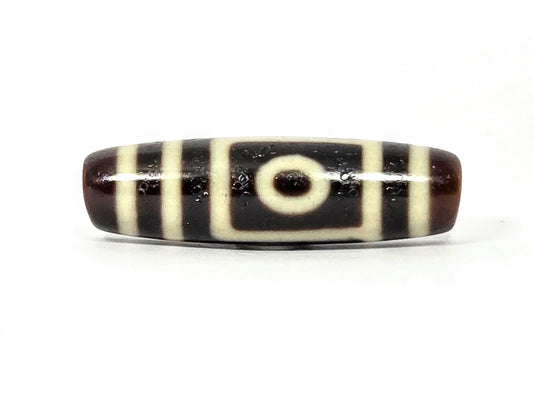 Two-eye dzi bead, dark brown and black agate with cream stripes, drilled horizontally, polished surface