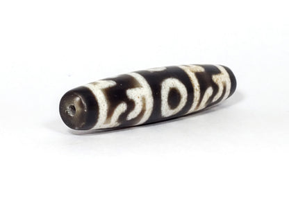 N-062226-GRRP, angled view toward broader end, drill hole centred, continuous motif visible, very dark brown, unretouched