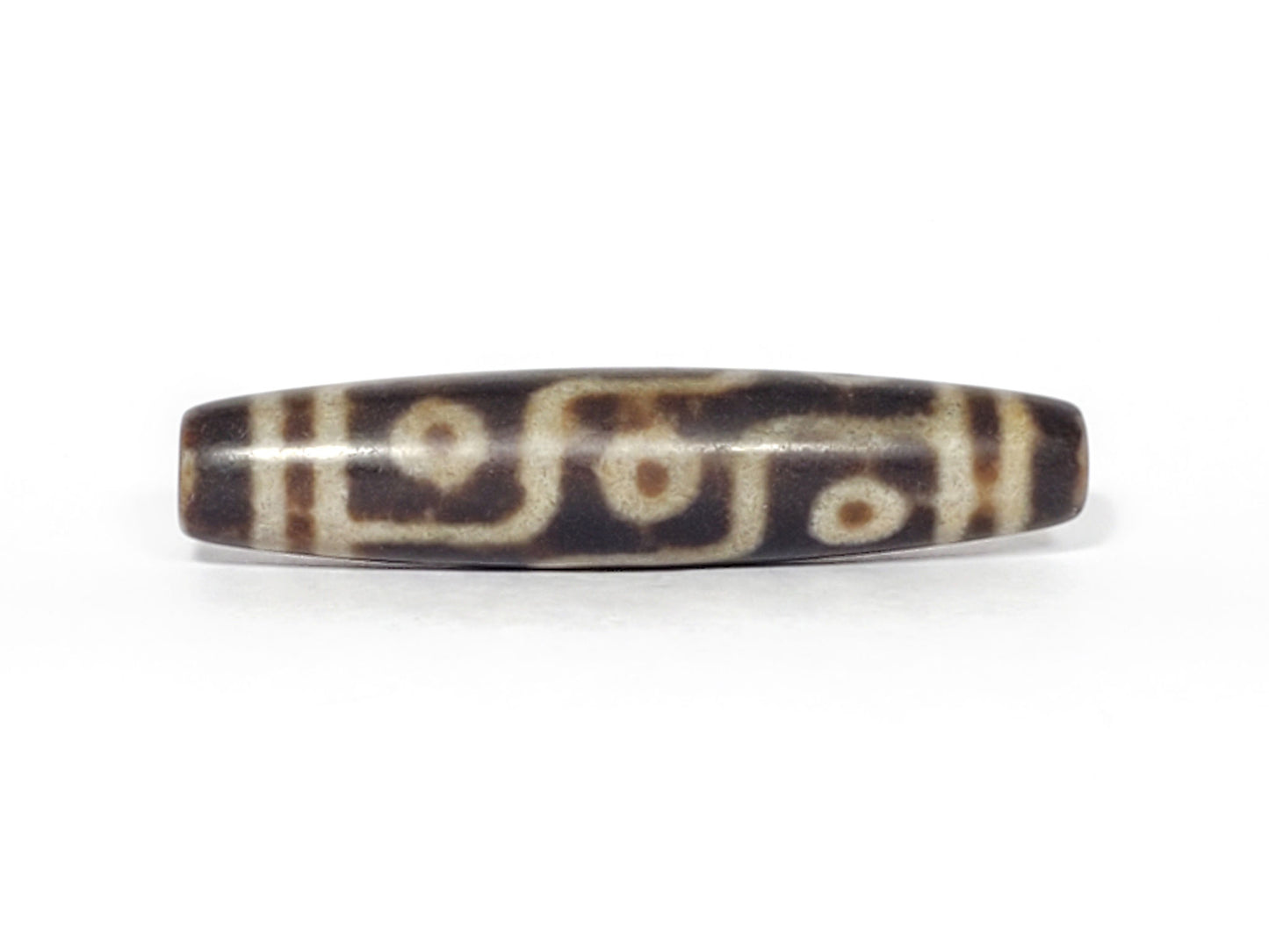 N-062226-9E3, face C, nine eye dzi, soft sandy-cream lines, warm brown agate, even symmetric fusiform, unretouched
