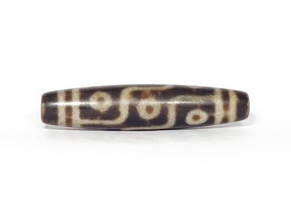 N-062226-9E3, face C, nine eye dzi, soft sandy-cream lines, warm brown agate, even symmetric fusiform, unretouched