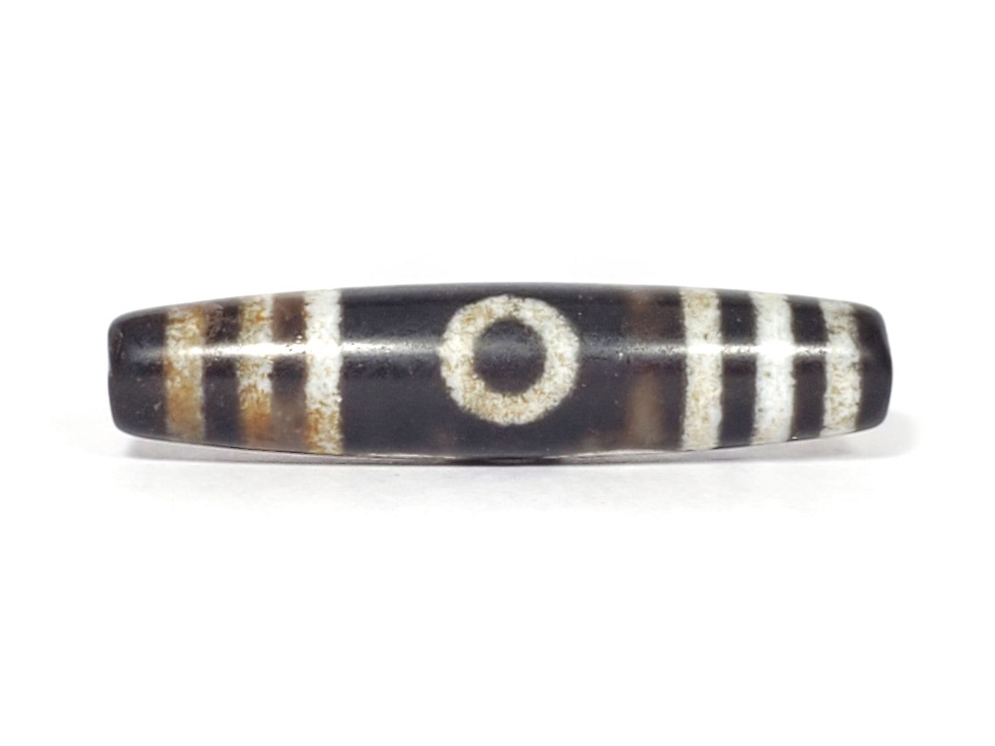 N-062426-3E2 new three eye dzi 57.9x13.3mm Face A single eye near-black ground warm rust-brown agate banding unretouched