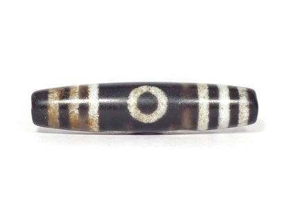 N-062426-3E2 new three eye dzi 57.9x13.3mm Face A single eye near-black ground warm rust-brown agate banding unretouched