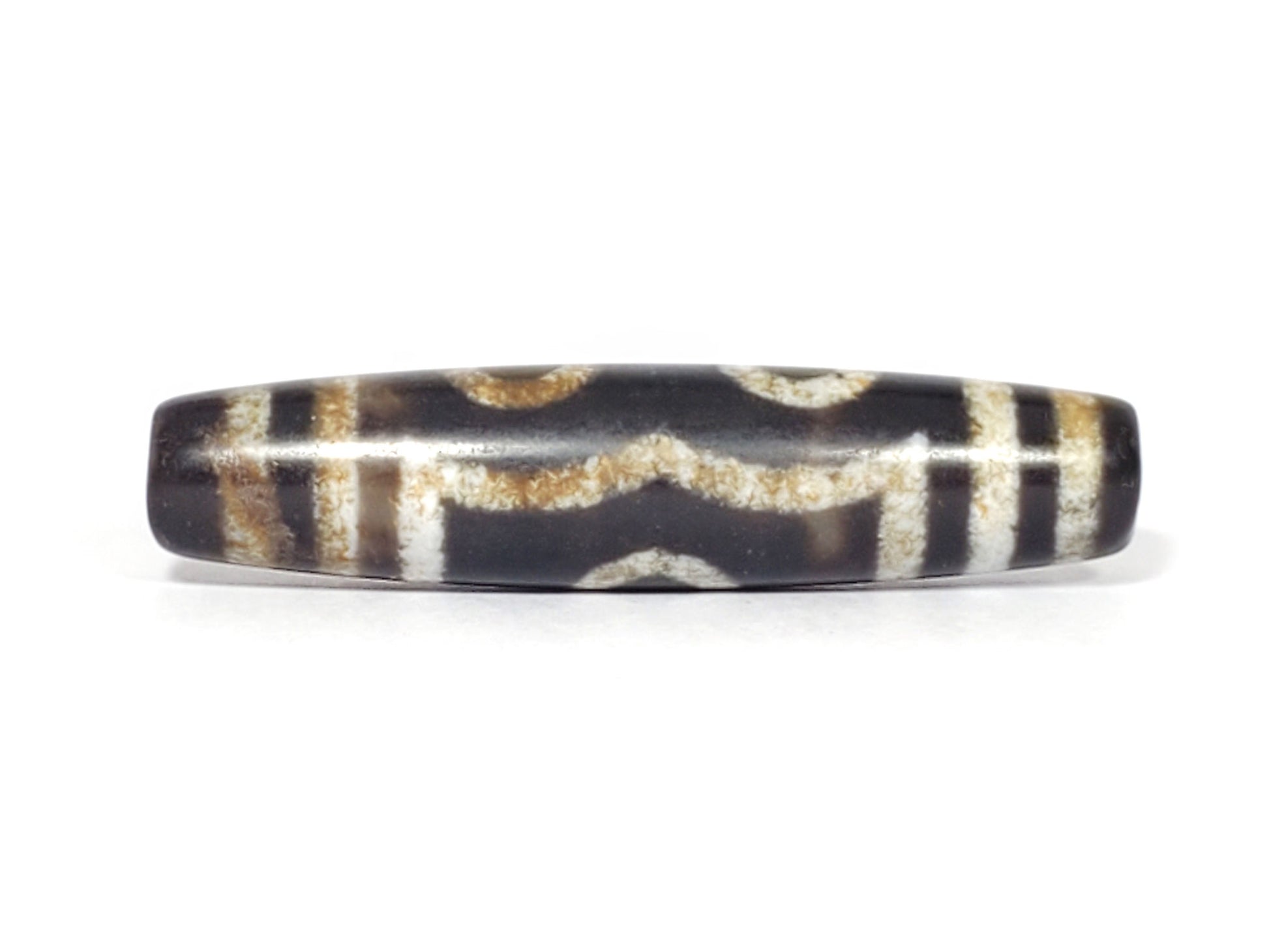 N-062426-3E2 three eye dzi 57.9x13.3mm Face D angular wave connector near-black warm-banded ground unretouched