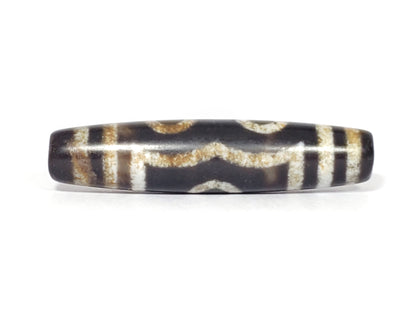 N-062426-3E2 three eye dzi 57.9x13.3mm Face D angular wave connector near-black warm-banded ground unretouched