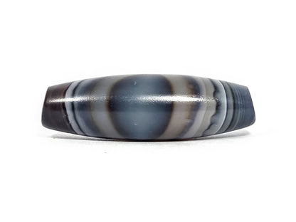 N-N-080926-1E6 natural one eye dzi bead 50.5×15.8mm, Face A showing broad blue-grey oval eye dome with cream stripe borders, unretouched