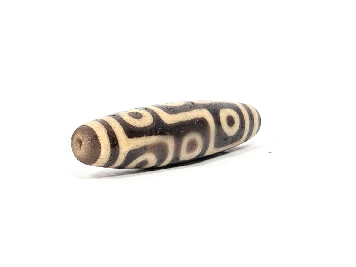 Tibetan dzi bead with eye motif pattern in cream and brown agate, drilled focal bead