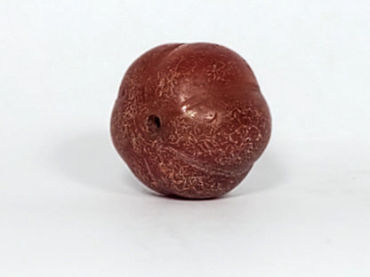 Ac-061126-PKP Bead B second face, natural banding visible in rib alignment, crackle in lobe valleys, unretouched