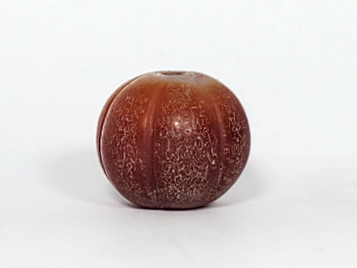 Ac-061126-PKP Bead B angled drill hole end, golden-brown zone with natural banding, weathered bore, unretouched