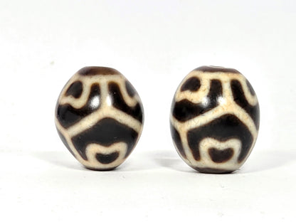 Pair of Round Tibetan Dzi Beads featuring the Six Eye Lotus Motif (R-SiEL-010326)