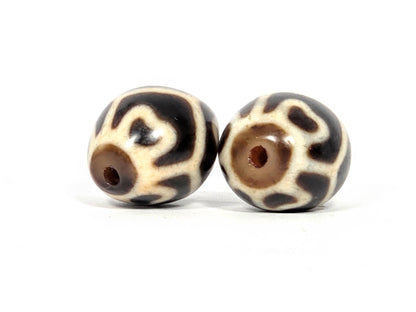 Pair of Round Tibetan Dzi Beads featuring the Six Eye Lotus Motif (R-SiEL-010326)