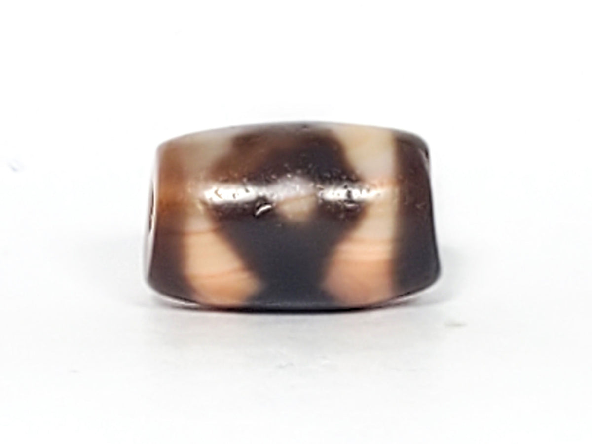 At-061926-3E2 Face A, warm peach-cream ground, dark brown motif form, 16.7×10.8mm, unretouched