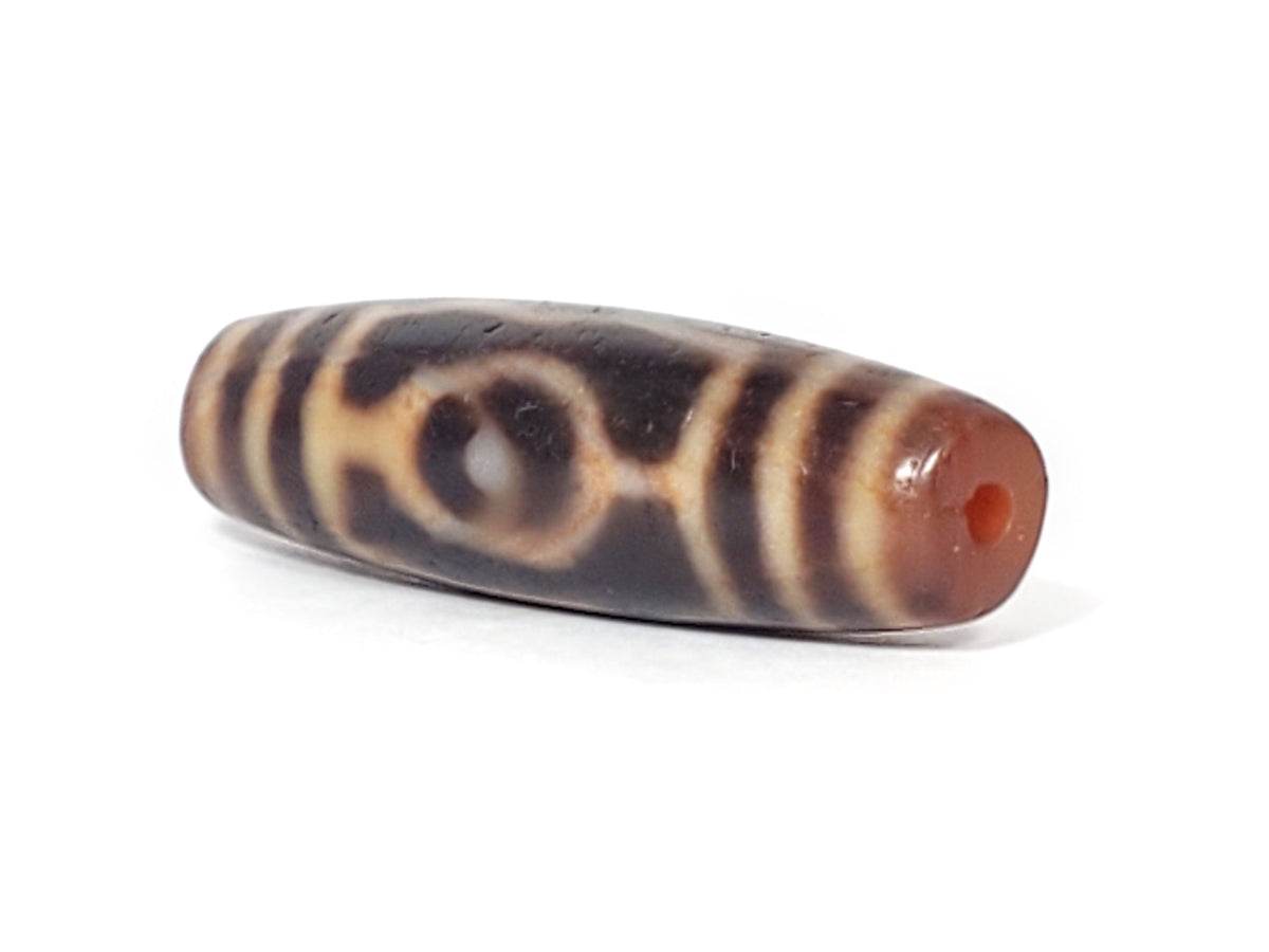 At-061926-3EEG angled tip B, linked ring motif visible, terracotta end cap, unretouched